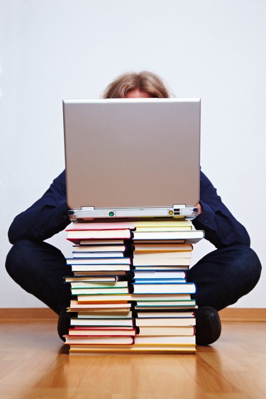 laptop on stacked books